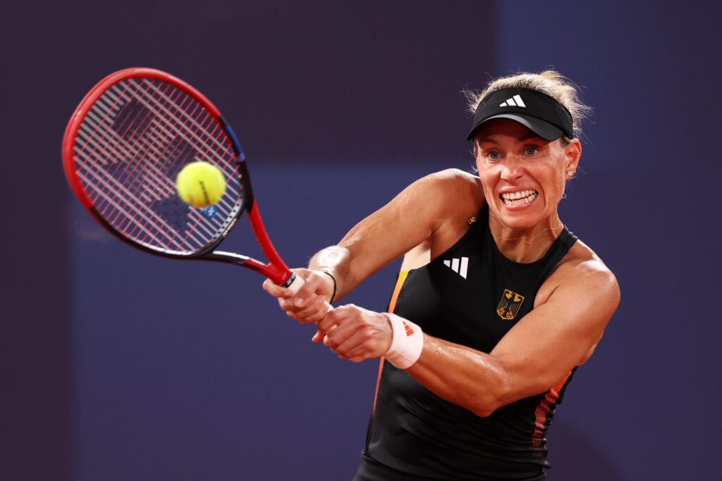 Angelique Kerber of Team Germany plays a backhand against Qinwen Zheng of Team People's Republic of China during the Women's Singles Quarter-final match on day five of the Olympic Games Paris 2024 at Roland Garros on July 31, 2024 in Paris, France.
