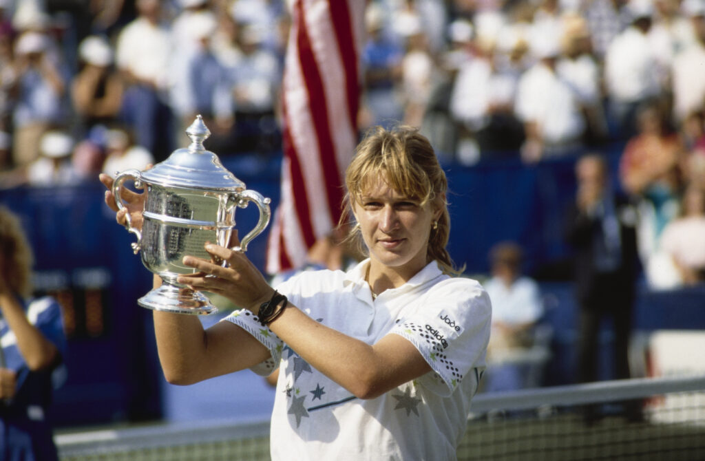 Steffi Graf holds the US Open trophy