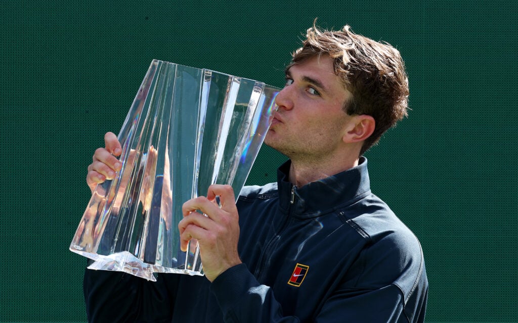 Jack Draper of Great Britain kisses his winners trophy after his straight sets victory against Holger Rune of Denmark during the Men's Singles Final of the BNP Paribas Open at Indian Wells Tennis Garden on March 16, 2025 in Indian Wells, California.