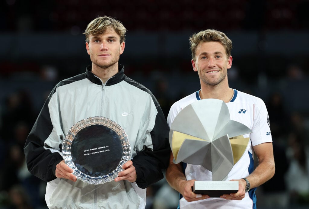 Jack Draper and Casper Ruud pose with their Madrid Open trophies in 2025