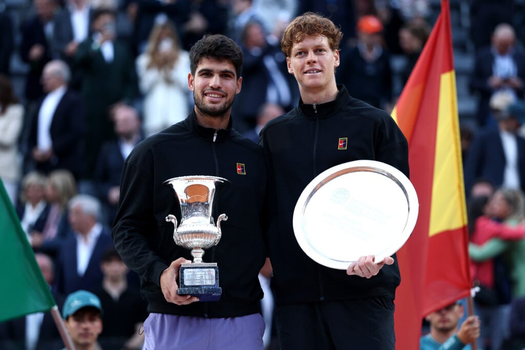 Carlos Alcaraz of Spain poses with the trophy as he celebrates victory alongside runner up Jannik Sinner of Italy following the Men's Singles Final match on Day Fourteen of the Internazionali BNL D'Italia 2025 at Foro Italico on May 18, 2025 in Rome, Italy.