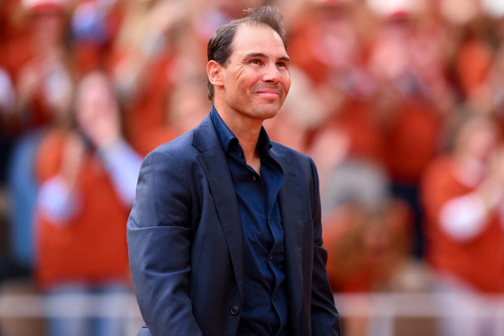 Rafael Nadal stands on Court Philippe-Chatrier during a ceremony held in his honour on Day One of the 2025 French Open at Roland Garros on May 25, 2025 in Paris, France.