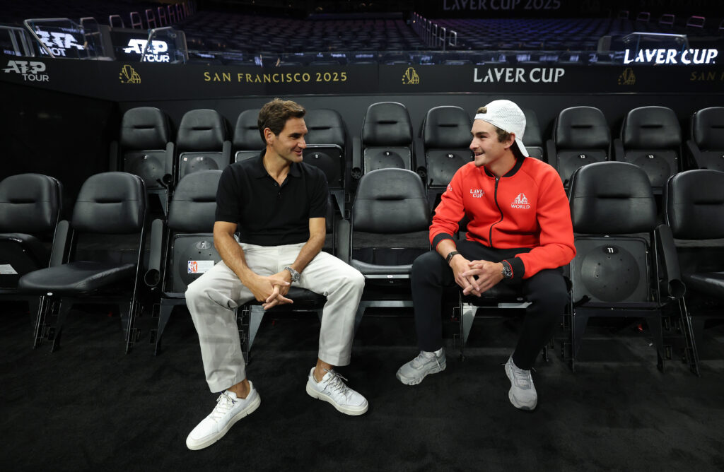 (L-R) Former tennis player Roger Federer speaks with Joao Fonseca of Team World prior to the start of the Laver Cup 2025 at Chase Center on September 16, 2025 in San Francisco, California.