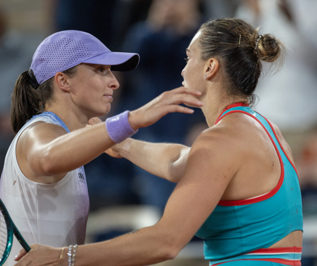 Winner Aryna Sabalenka and Iga Swiatek of Poland embrace at the net after their semi-final of the Women's singles competition on Court Philippe-Chatrier during the 2025 French Open Tennis Tournament at Roland Garros on June 5th, 2025, in Paris, France.