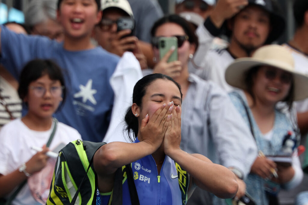 Philippines' Alexandra Eala acknowledges the fans as she leaves the court after her women's singles match against USA's Alycia Parks on day two of the Australian Open tennis tournament in Melbourne on January 19, 2026.