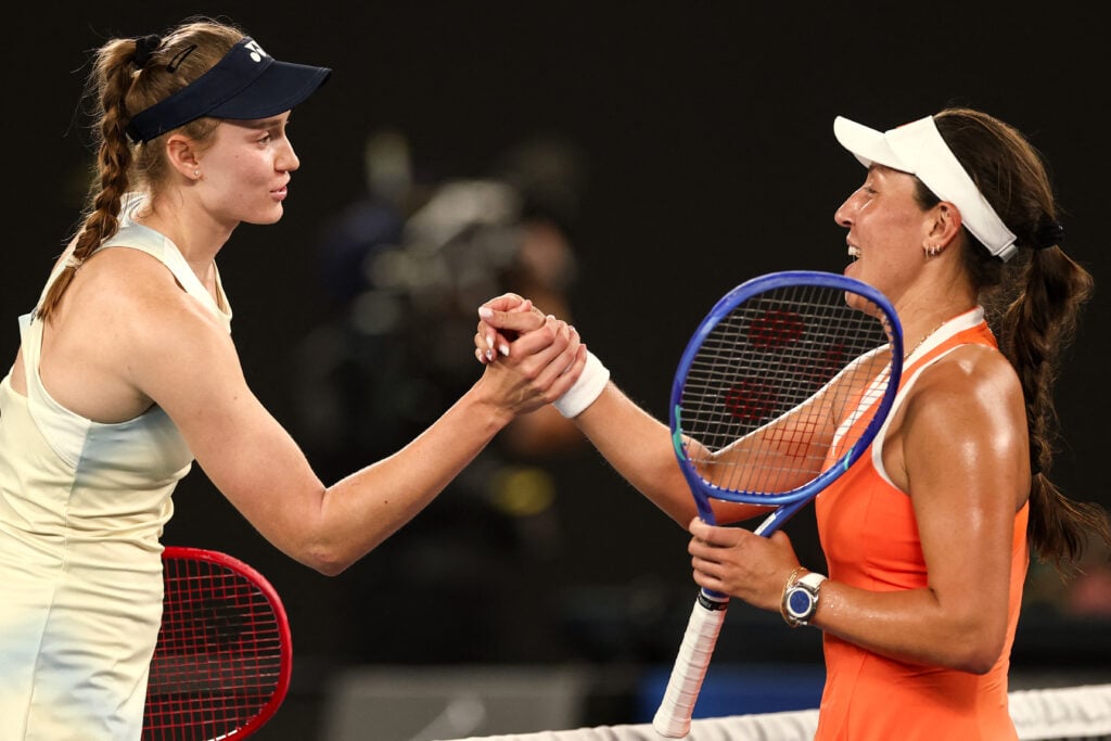 Kazakhstan's Elena Rybakina (L) shakes hands with USA's Jessica Pegula after victory during their women's singles semi-final match on day twelve of the Australian Open tennis tournament in Melbourne on January 29, 2026.