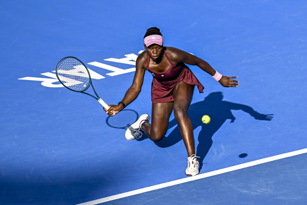 Victoria Mboko of Canada competes in her round of 16 match against Mirra Andreeva of Russia during the WTA Qatar TotalEnergies Open 2026 tennis tournament at the Khalifa International Tennis Complex in Doha, Qatar, on February 11, 2026.