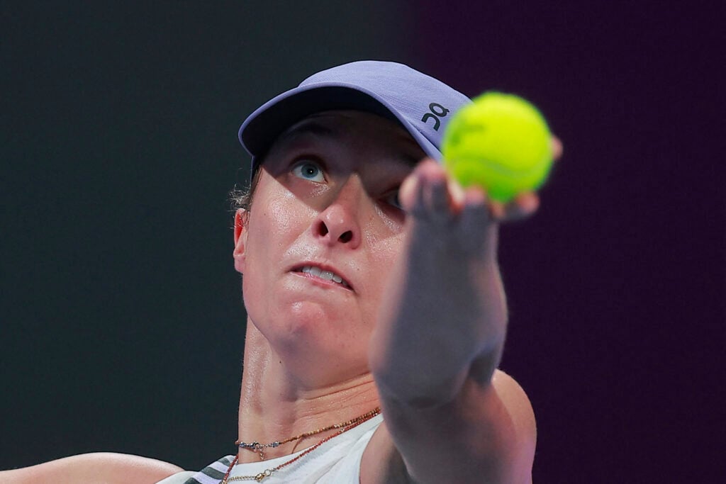 Poland's Iga Swiatek serves the ball against Australia's Daria Kasatkina during their women's singles match at the Qatar Open tennis tournament in Doha on February 11, 2026.
