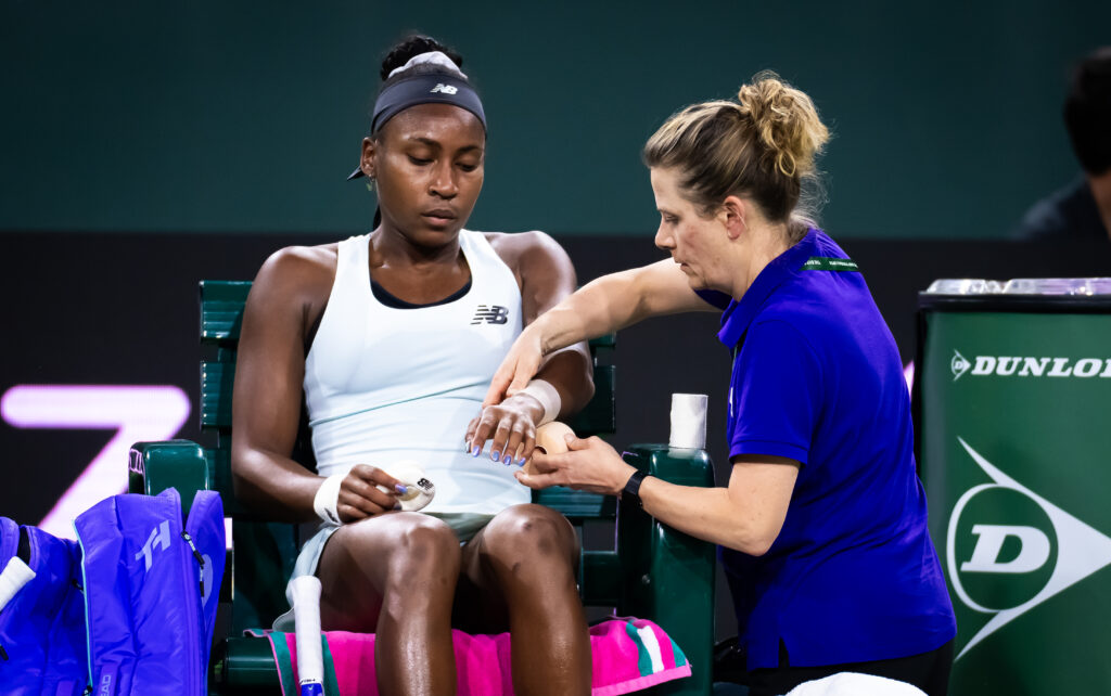 Coco Gauff of the United States receives treatment during a medical time out while playing against Alexandra Eala of the Philippines in the third round on Day 5 of the BNP Paribas Open at Indian Wells Tennis Garden on March 08, 2026 in Indian Wells, California