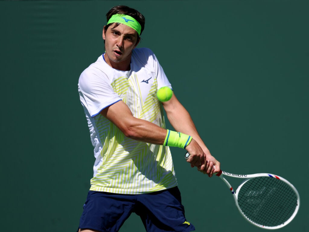 Alexander Shevchenko of Kazakhstan plays a backhand in a match against Casper Ruud of Norway during Day 4 of the BNP Paribas Open at Indian Wells Tennis Garden on March 07, 2026 in Indian Wells, California.