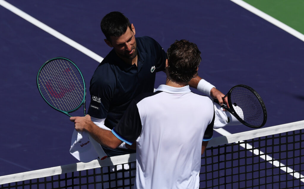 Novak Djokovic of Serbia shakes hands at the net after his three set victory against Aleksandar Kovacevic of the United States in their third round match of the BNP Paribas Open at Indian Wells Tennis Garden on March 09, 2026 in Indian Wells, California.