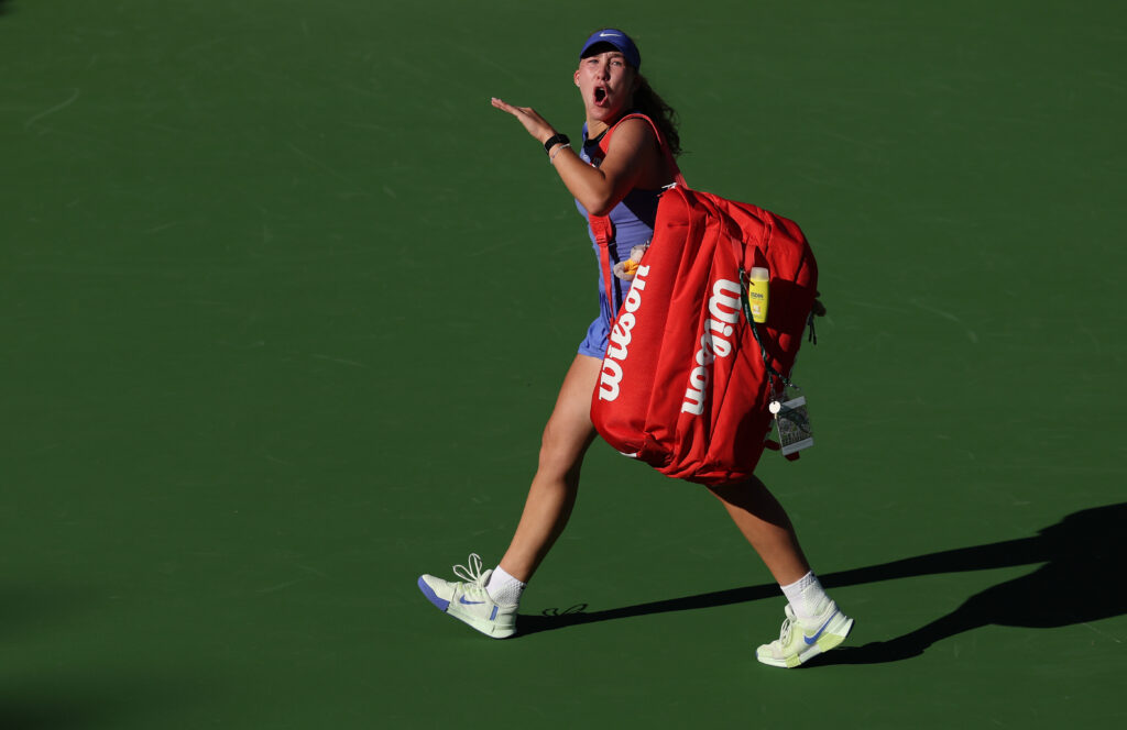 Mirra Andreeva walks off the court after losing to Katerina Siniakova at Indian Wells