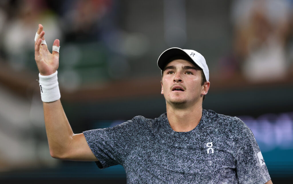 Joao Fonseca of Brazil reacts to the crowd against Jannik Sinner of Italy in their fourth round match of the BNP Paribas Open at Indian Wells Tennis Garden on March 10, 2026 in Indian Wells, California.
