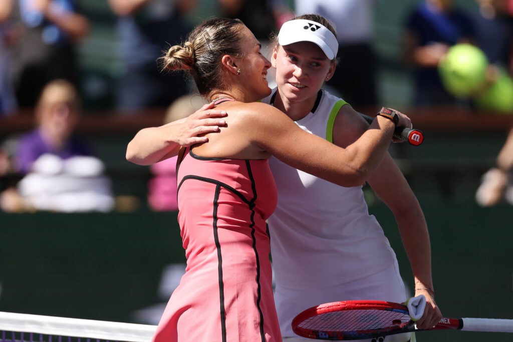 Aryna Sabalenka and Elena Rybakina hug at Indian Wells in 2026