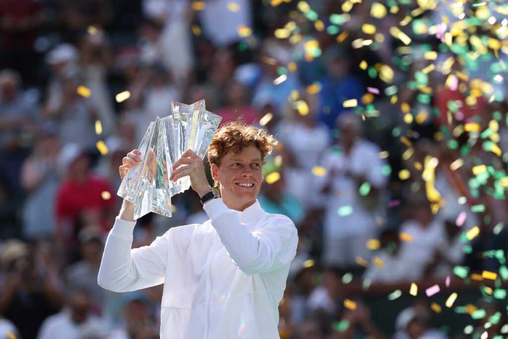 Jannik Sinner of Italy hoists the championship trophy after defeating Daniil Medvedev during their Men's Singles Finals match on Day 12 of the BNP Paribas Open at Indian Wells Tennis Garden on March 15, 2026 in Indian Wells, California.