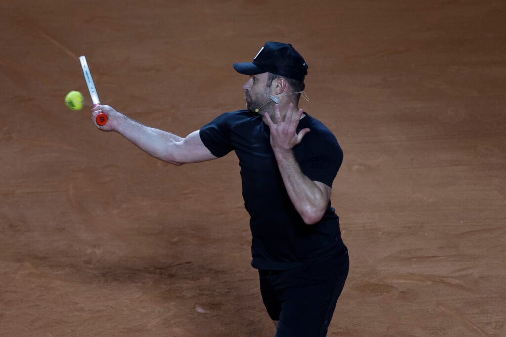 US former player Andrew Roddick returns during an exhibition match against Argentina's former tennis players Diego Schwartzman (L) and Juan Martin Del Potro ahead of the Latin America Open Tournament in Sao Paulo, Brazil on March 21, 2026.