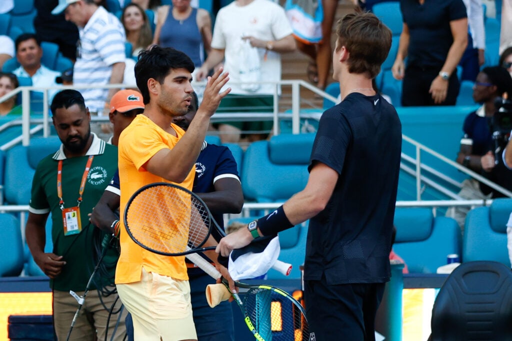 Carlos Alcaraz and Sebastian Korda embrace after their match at the 2026 Miami Open