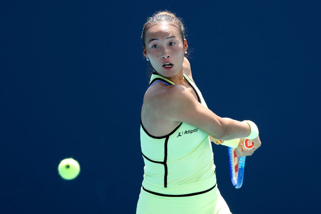 Qinwen Zheng of China returns a shot to Sloane Stephens of the United States on Day 5 of the Miami Open Presented by Itau at Hard Rock Stadium on March 21, 2026 in Miami Gardens, Florida.