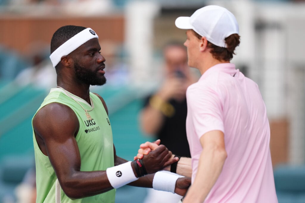 Frances Tiafoe of the United States and Jannik Sinner of Italy shake hands at the end of their quarter final match on day 10 of the Miami Open at Hard Rock Stadium on March 26, 2026 in Miami Gardens, Florida.