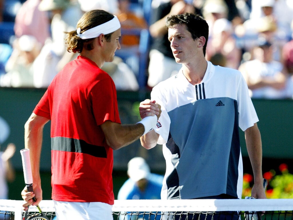 Roger Federer of Switzerland is congratulated by Tim Henman of Great Britain during the finals of the Pacific Life Open, March 21, 2004, at the Indian Wells Tennis Garden in Indian Wells, California.
