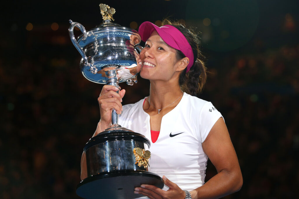 Na Li of China kisses the Daphne Akhurst Memorial Cup after winning the women's final match against Dominika Cibulkova of Slovakia during day 13 of the 2014 Australian Open at Melbourne Park on January 25, 2014 in Melbourne, Australia.