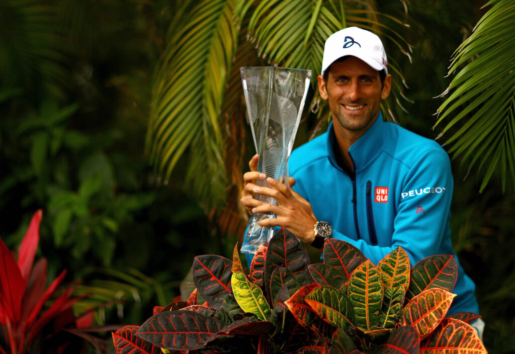 Novak Djokovic of Serbia poses with the Butch Buchholz Trophy after winning the Men's Final against Kei Nishikori of Japan during Day 14 of the Miami Open presented by Itau at Crandon Park Tennis Center on April 3, 2016 in Key Biscayne, Florida.