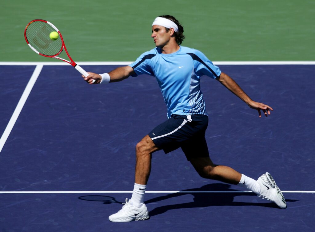 Roger Federer of Switzerland hits a forehand in the frontcourt to James Blake during the Men's singles final of the Pacific Life Open at the Indian Wells Tennis Garden on March 19, 2006 in Indian Wells, California. Federer defeated Blake 7-5, 6-3, 6-0.