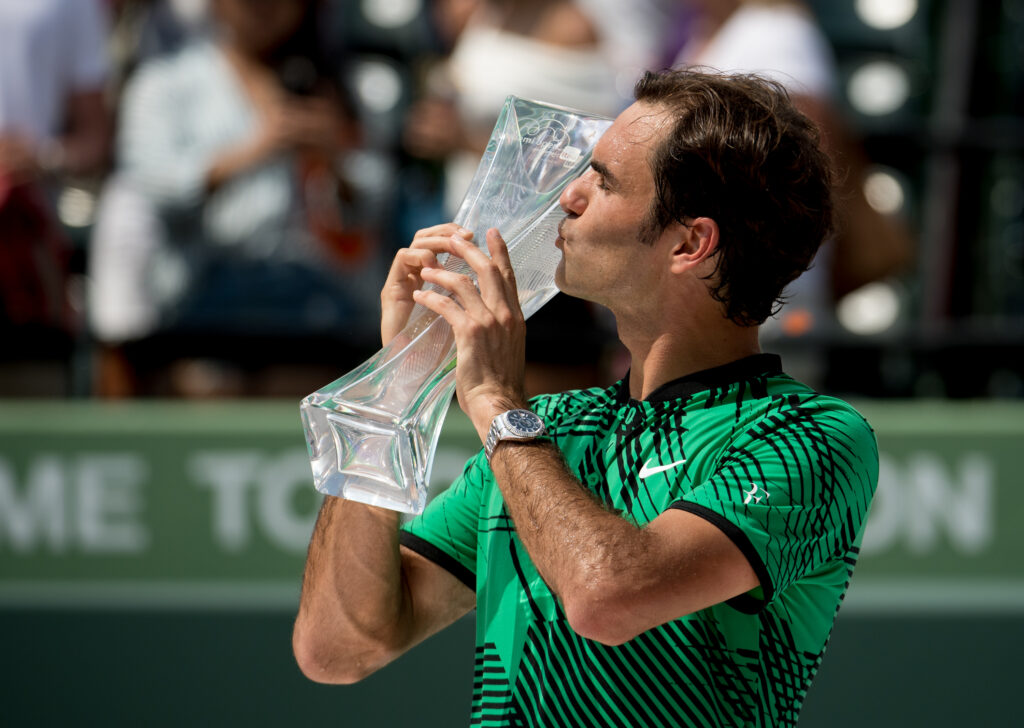 Roger Federer of Switzerland with the winners trophy after defeating Rafael Nadal of Spain on day 14 of the Miami Open at Crandon Park Tennis Center on April 2, 2017 in Key Biscayne, Florida.