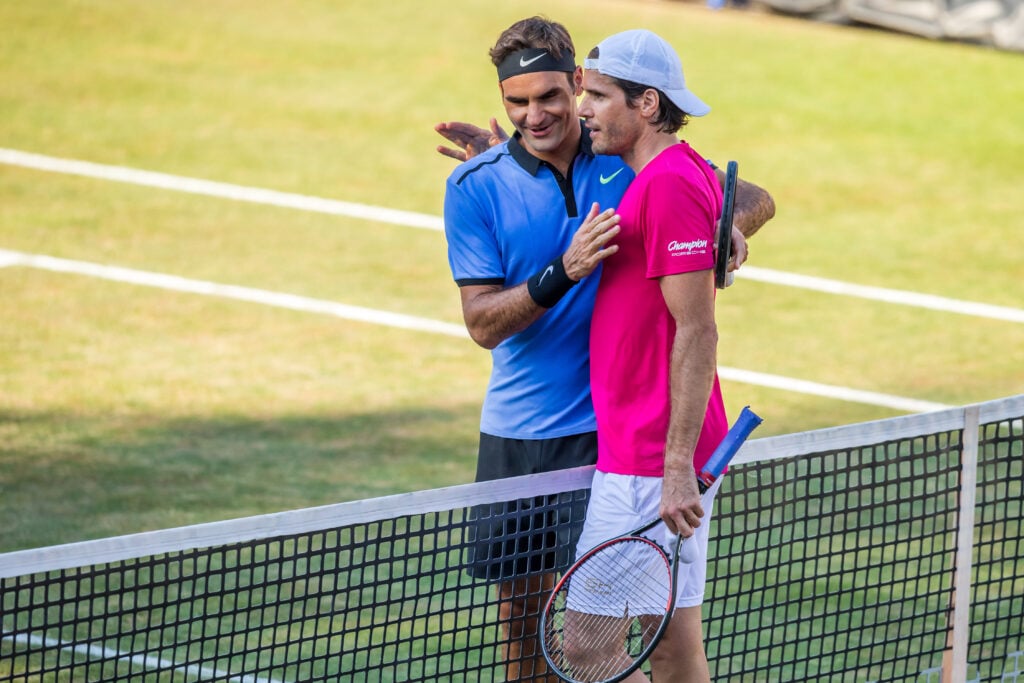 Roger Federer of Switzerland (L) congratulates Tommy Haas (R) of Germany after their round of sixteen match of Mercedes Cup 2017 on June 14, 2017 in Stuttgart, Germany.