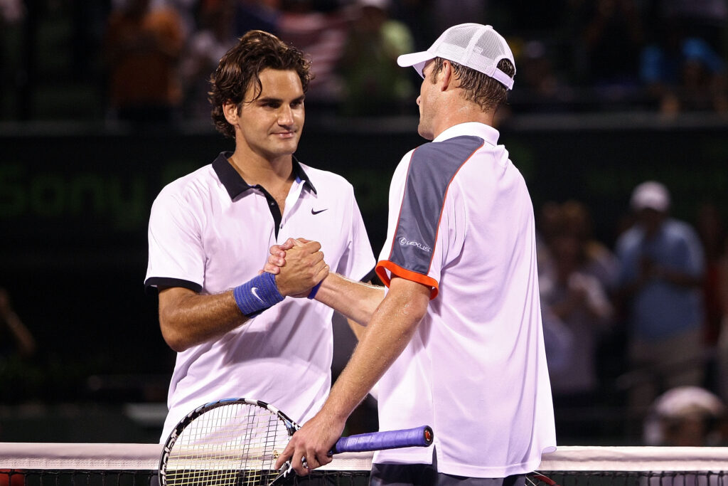 Andy Roddick shakes hands with Roger Federer of Switzerland after defeating him during day eleven of the Sony Ericsson Open at the Crandon Park Tennis Center on April 3, 2008 in Key Biscayne, Florida.