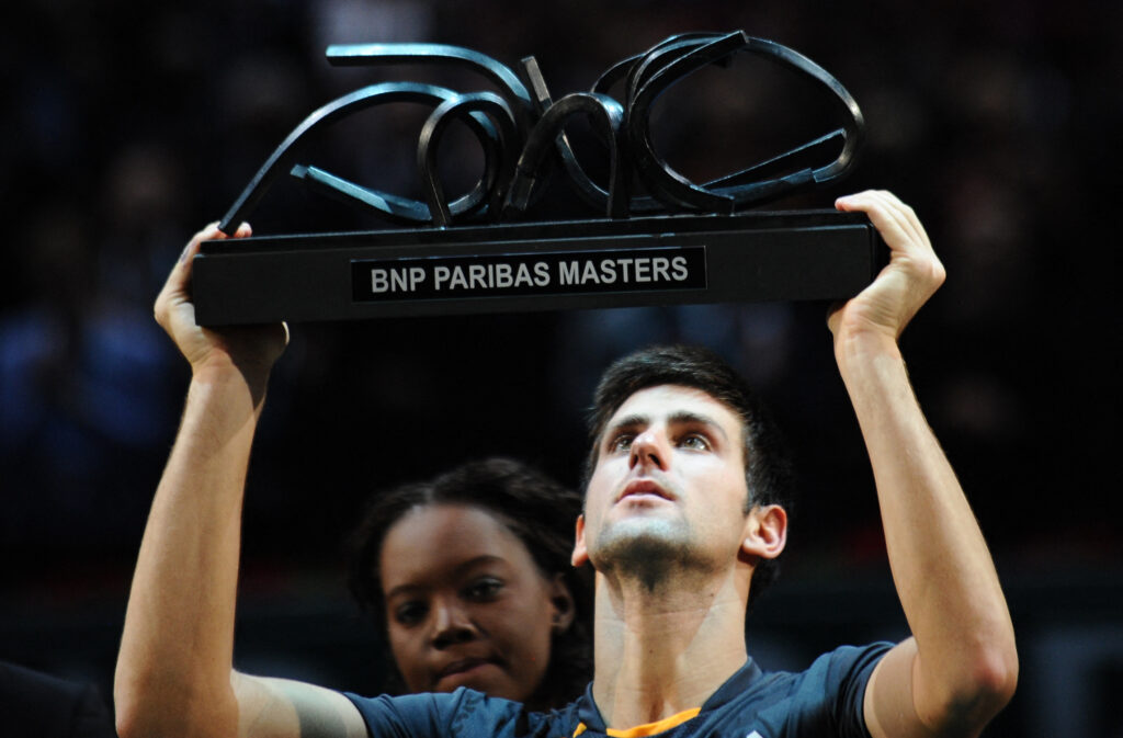 Serbian Novak Djokovic celebrates with his trophy at the end of his Paris Masters ATP tournament final tennis match against French Gael Monfils on November 15, 2009 at the "Palais Omnisports de Paris Bercy" in Paris. Djokovic won 6-2, 5-7, 7-6.