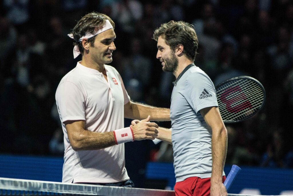 Gilles Simon and Roger Federer shake hands