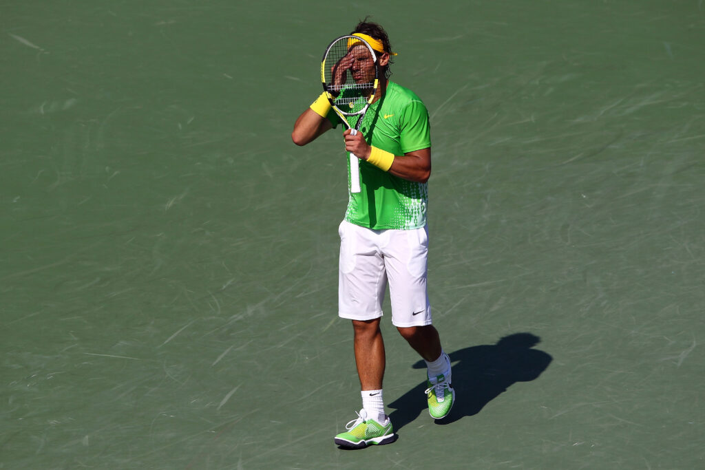 Rafael Nadal of Spain reacts against Novak Djokovic of Serbia during the men's singles championship at the Sony Ericsson Open at Crandon Park Tennis Center on April 3, 2011 in Key Biscayne, Florida.