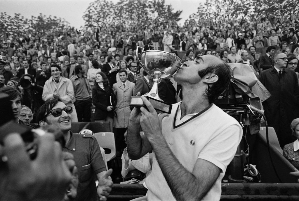 Spanish Andres Gimeno kisses his trophy after winning the French Tennis Open in Paris beating Patrick Proisy 19 May 1972.