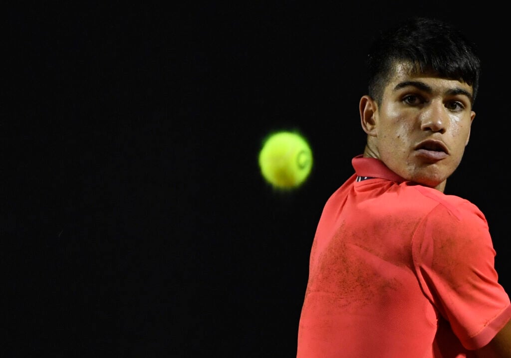 Spain's Carlos Alcaraz returns a ball during a match against Argentina's tennis player Federico Coria during ATP World Tour Rio Open 2020 tournament, Jockey Club in Rio de Janeiro, Brazil on February 19, 2020.