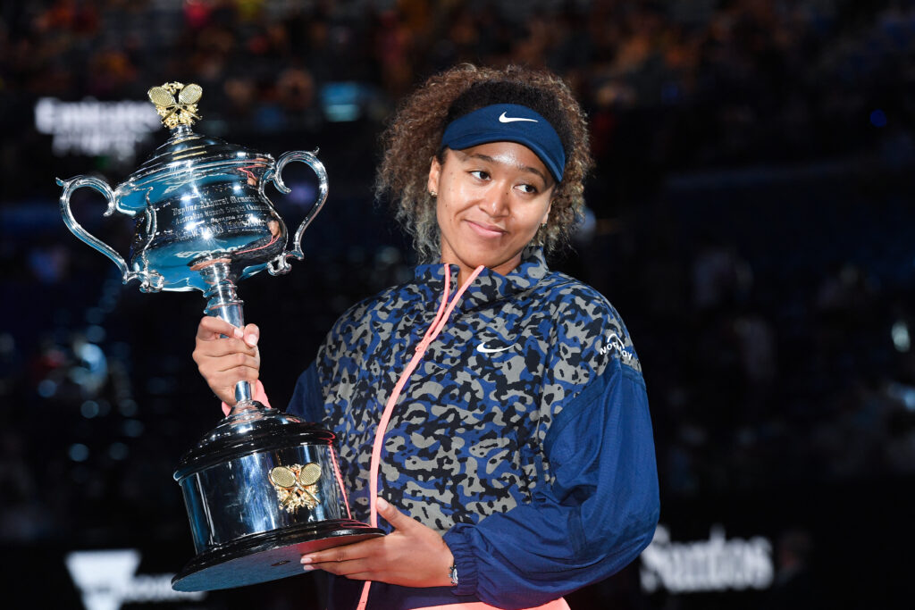 Naomi Osaka poses with the Australian Open trophy