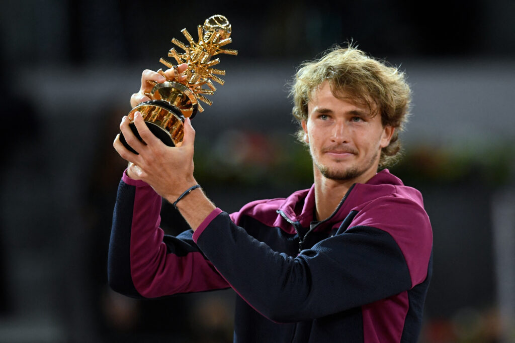 Germany's Alexander Zverev holds up the winner's trophy after beating Italy's Matteo Berrettini during their 2021 ATP Tour Madrid Open tennis tournament singles final match at the Caja Magica in Madrid on May 9, 2021.