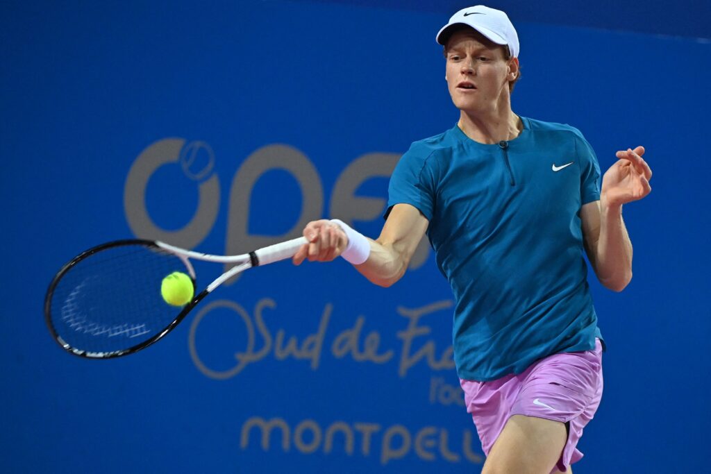 Italy's Jannik Sinner returns the ball to France's Arthur Fils during their men's semi-final singles tennis match at the Open Sud de France ATP World Tour event in Montpellier, on February 11, 2023.