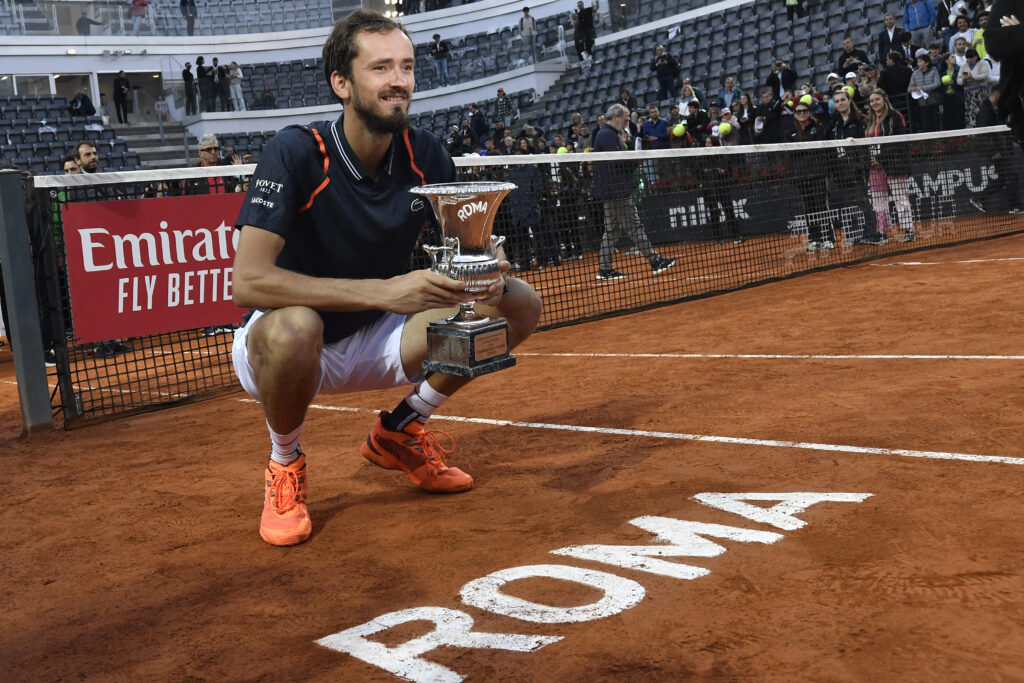 Daniil Medvedev of Russia poses with the trophy at the end