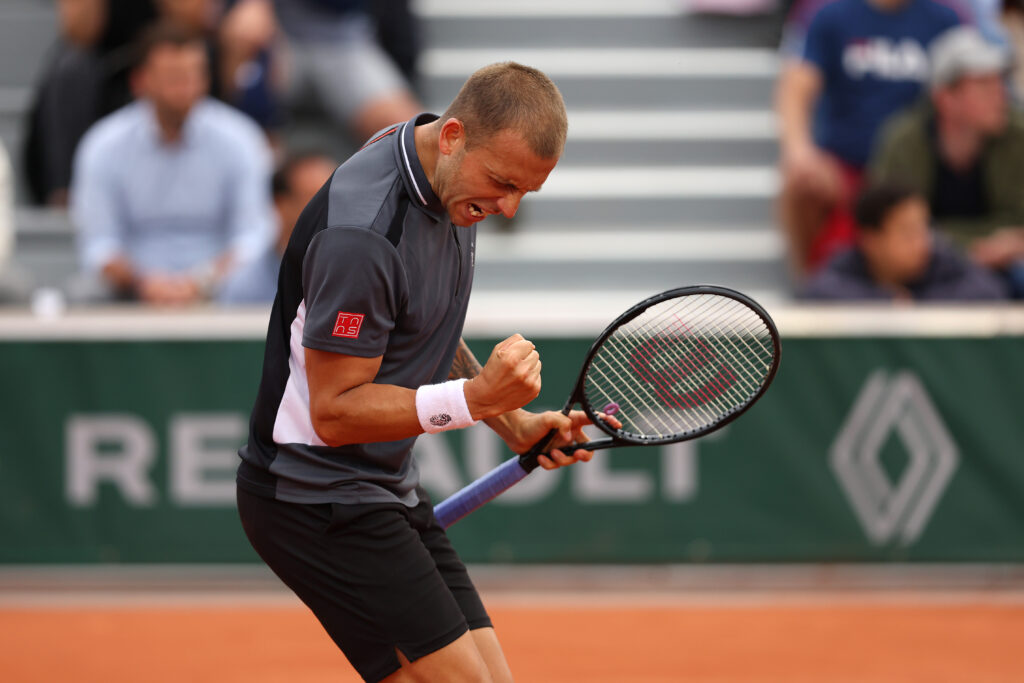 Dan Evans of Great Britain celebrates a point against Mikael Ymer of Sweden during the Men's singles Second Round on Day Five of the 2022 French Open at Roland Garros on May 26, 2022 in Paris, France