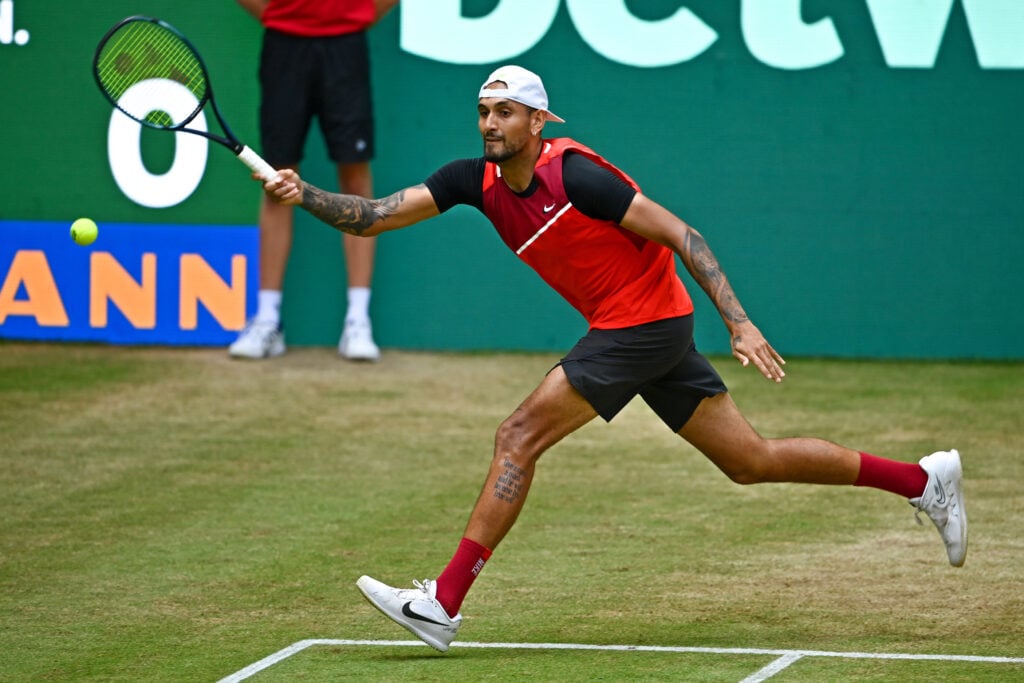 Nick Kyrgios hits a forehand