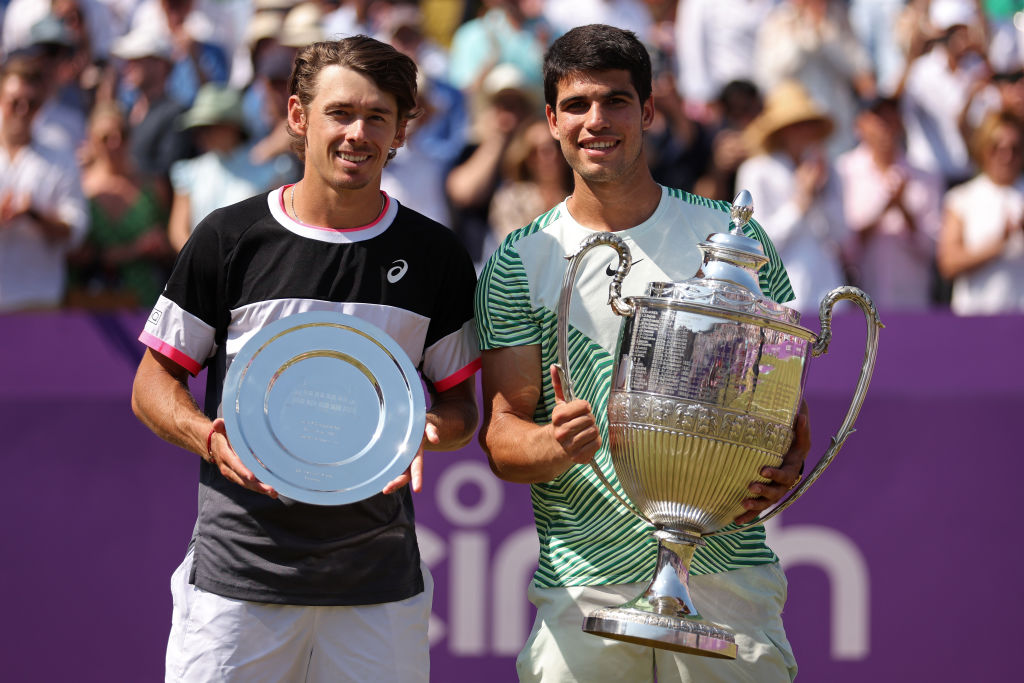 Runner-up, Alex De Minaur of Australia and Winner, Carlos Alcaraz of Spain, pose with their trophies after the Men's Singles Final match on Day Seven of the cinch Championships at The Queen's Club on June 25, 2023 in London, England.