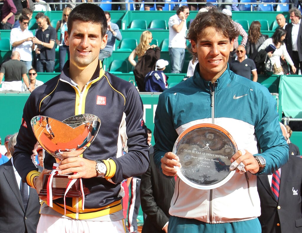Spain's Rafael Nadal (R) and Serbia's Novak Djokovic (L) pose with their trophies at the end of the Monte-Carlo ATP Masters Series tennis Tournament final on April 21, 2013 in Monaco.