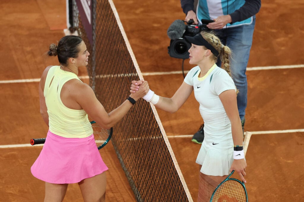 Aryna Sabalenka of Belarus and Mirra Andreeva shake hands following their Women's Quarter-Final match on Day Nine of the Muta Madrid Open at La Caja Magica on May 01, 2024 in Madrid, Spain.