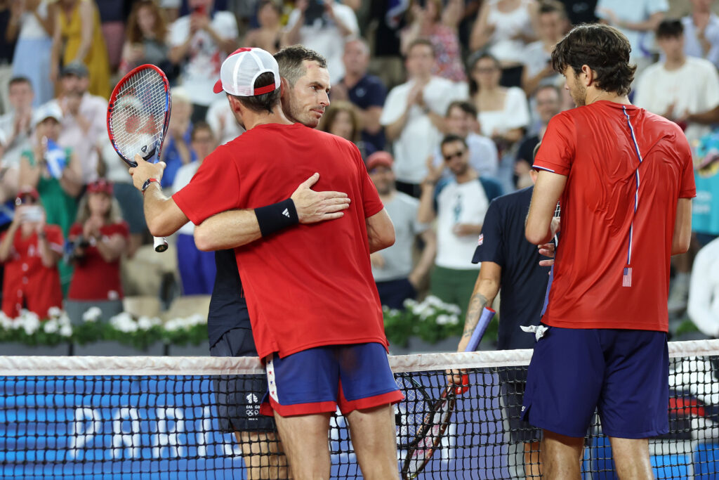 Andy Murray of Team Great Britain and Daniel Evans of Team Great Britain congratulate Tommy Paul of Team United States and Taylor Fritz of Team United States on their victory after the Men's Doubles Quarter-final match on day six of the Olympic Games Paris 2024 at Roland Garros on August 01, 2024 in Paris, France.