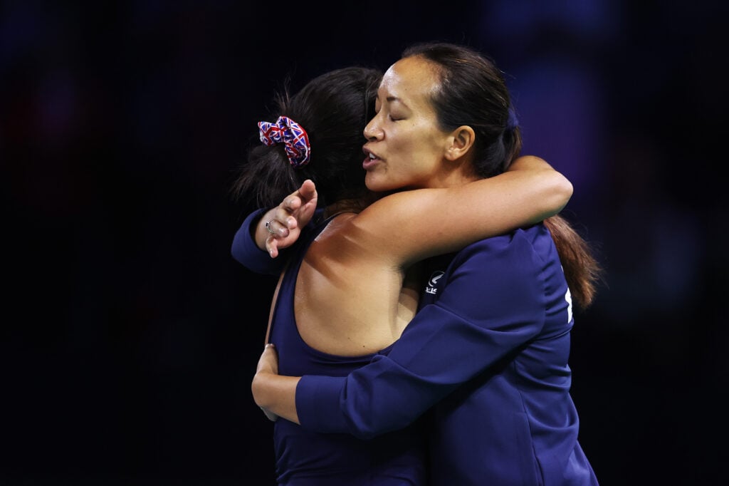 Anne Keothavong, Captain of Great Britain, consoles Heather Watson of Great Britain following defeat with partner Olivia Nicholls in their doubles match against Viktoria Hruncakova and Tereza Mihalikova of Slovakia in the semifinal tie between Great Britain and Slovakia during the Billie Jean King Cup Finals at Palacio de Deportes Jose Maria Martin Carpena on November 19, 2024 in Malaga, Spain.