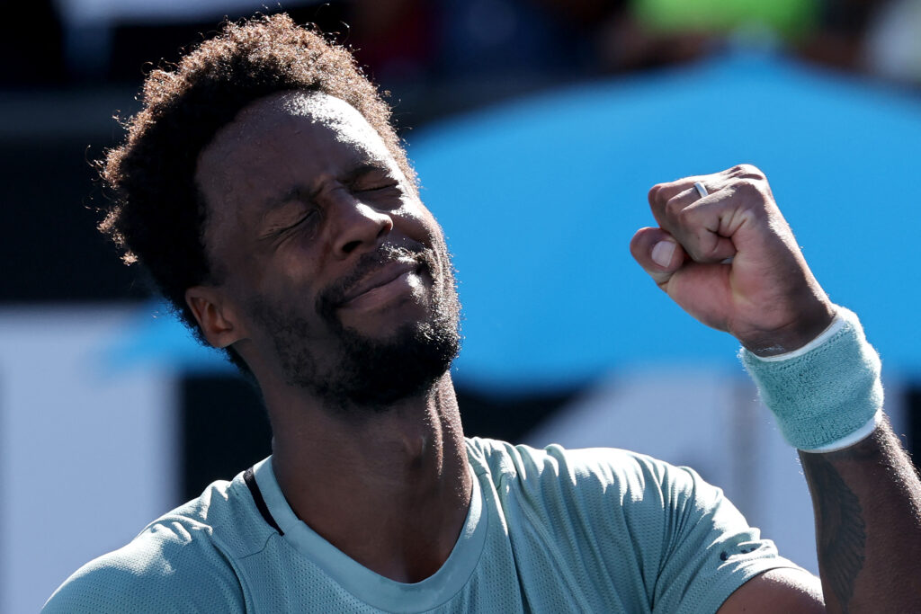 France's Gael Monfils celebrates the match point against compatriot Giovanni Mpetshi Perricard during their men's singles match on day three of the Australian Open tennis tournament in Melbourne on January 14, 2025.