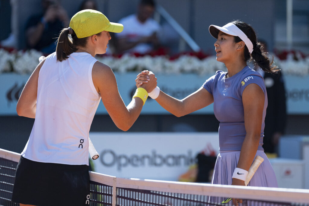 Iga Swiatek and Alex Eala shake hands after their match at the 2025 Madrid Open