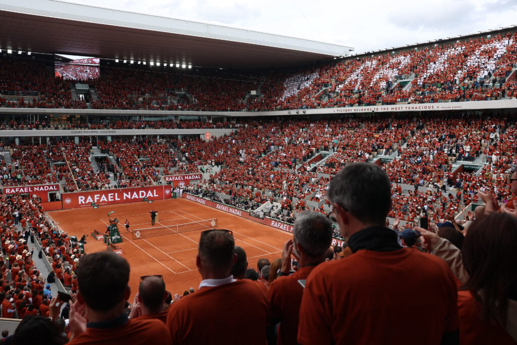 Rafael Nadal waves to the crowd on Court Philippe-Chatrier during a ceremony held in his honour on Day One of the 2025 French Open at Roland Garros on May 25, 2025 in Paris, France.