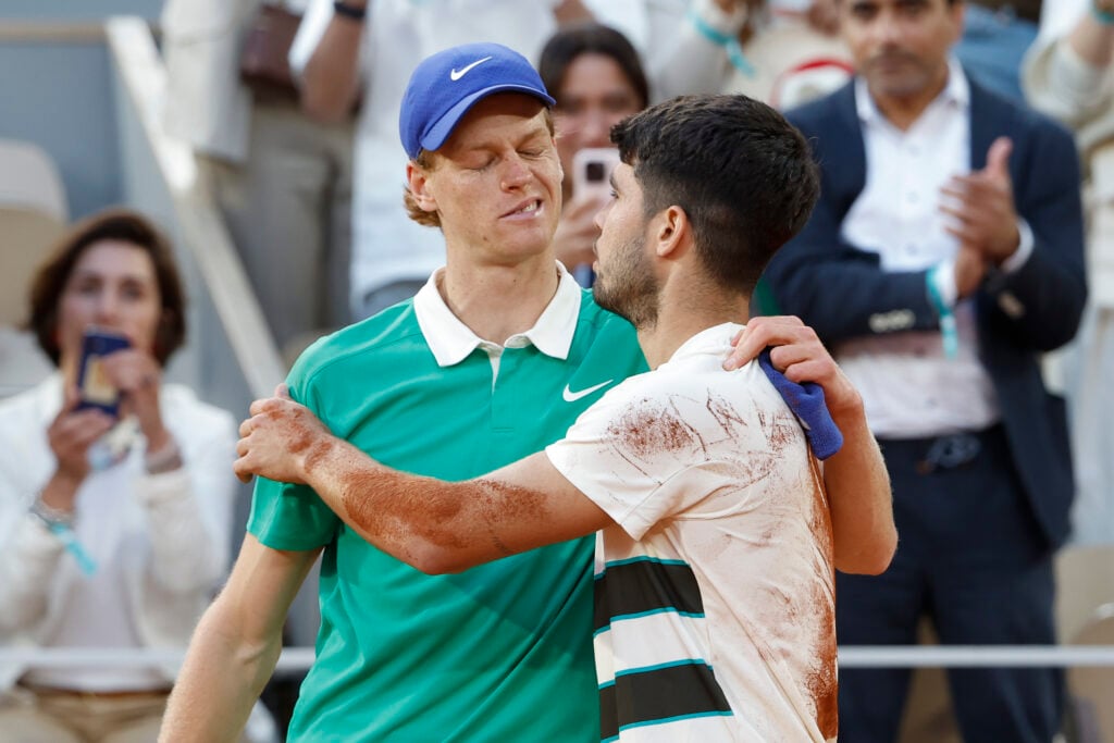 Carlos Alcaraz of Spain (R) salutes Jannik Sinner of Italy at the net after his victory in the men's final on day 15 of the 2025 French Open, Roland-Garros 2025, Grand Slam tennis tournament at Roland Garros stadium on June 8, 2025 in Paris, France.